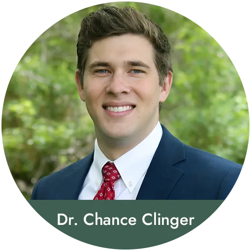 Dr. Chance Clinger, dentist at Valley Dental Care Chandler, professional headshot outdoors.